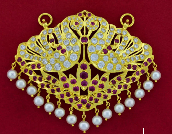 Royal peacock pathakam pendant in gold with superior CZ and pearl drops.