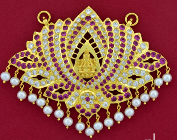 Unique pathakam pendant with floral inspired pattern with rubies and hanging pearls.