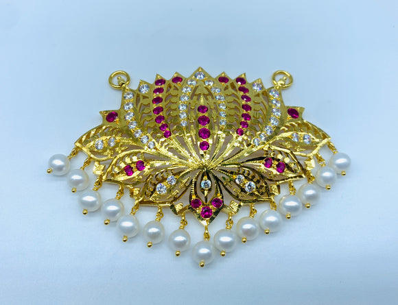Divine pathakam pendant with rubies, CZ gems and freshwater pearls.