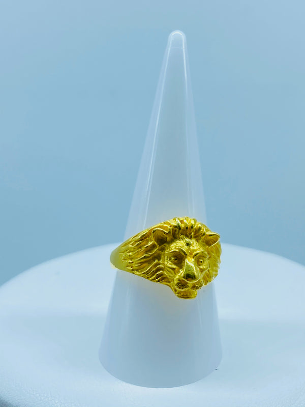 Elaborately designed ferocious Mane Lion face over a genuine solid yellow gold band with a radiant shine.